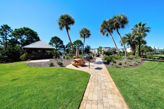 view of property's community featuring a gazebo and a lawn