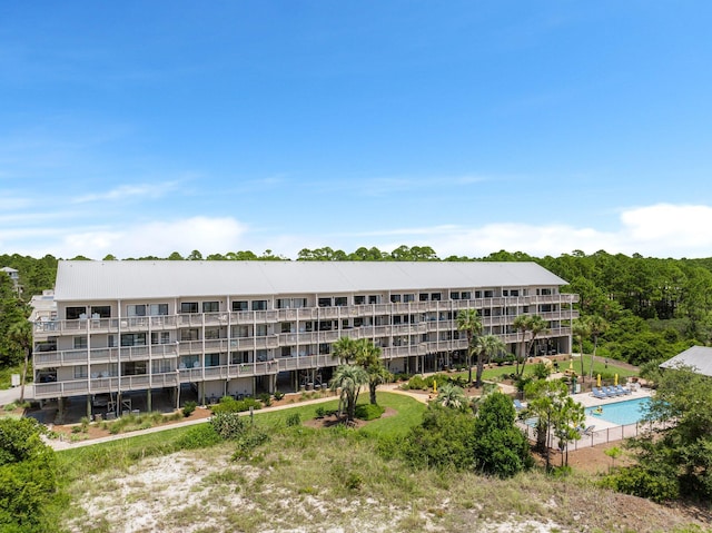 view of building exterior with a community pool