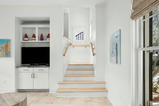 95 Rosemary Ave, Rosemary Beach, FL 32461 - staircase featuring baseboards