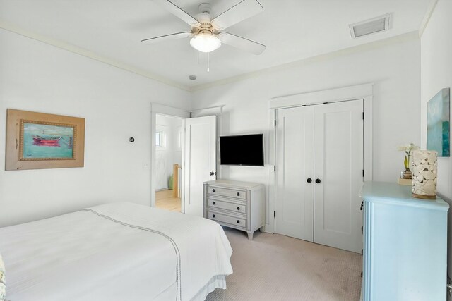 95 Rosemary Ave, Rosemary Beach, FL 32461 - bedroom with a ceiling fan, visible vents, a closet, and light carpet
