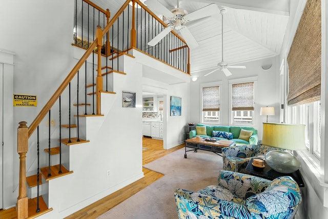 95 Rosemary Ave, Rosemary Beach, FL 32461 - living area with high vaulted ceiling, wood finished floors, stairway, baseboards, and ceiling fan