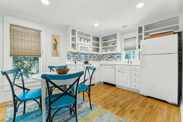 95 Rosemary Ave, Rosemary Beach, FL 32461 - kitchen with white appliances, open shelves, light wood-style flooring, white cabinetry, and backsplash