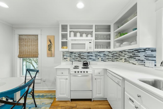 95 Rosemary Ave, Rosemary Beach, FL 32461 - kitchen with light wood finished floors, white appliances, white cabinetry, and light countertops