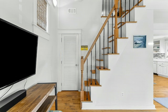95 Rosemary Ave, Rosemary Beach, FL 32461 - entrance foyer featuring visible vents, stairway, and wood finished floors