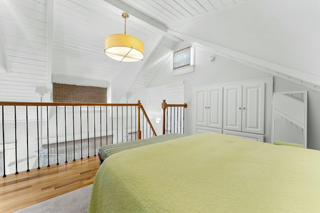 95 Rosemary Ave, Rosemary Beach, FL 32461 - bedroom with lofted ceiling with beams and wood finished floors