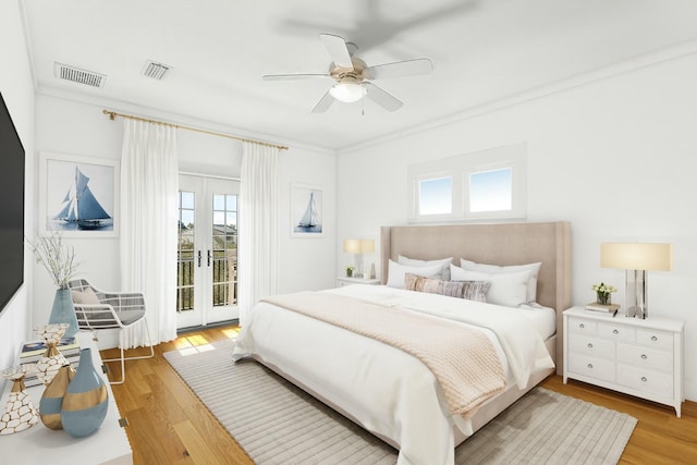 95 Rosemary Ave, Rosemary Beach, FL 32461 - bedroom with light wood finished floors, visible vents, and access to outside