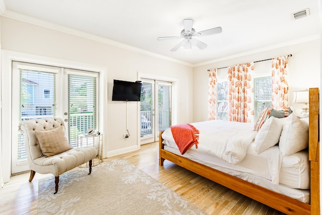 bedroom featuring light wood-type flooring, visible vents, access to exterior, and ornamental molding