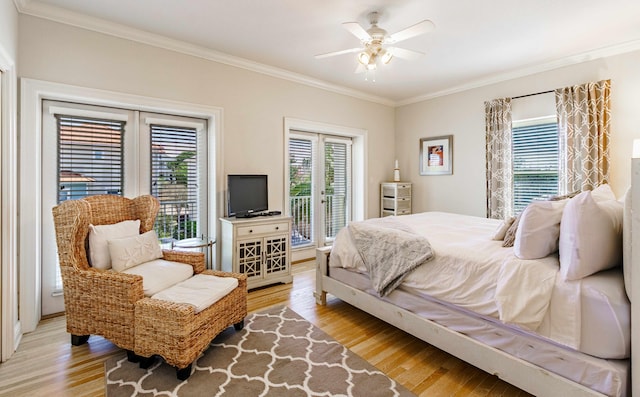 bedroom featuring ceiling fan, light wood-type flooring, access to exterior, and ornamental molding