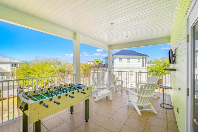 exterior space featuring tile patterned flooring and a wealth of natural light