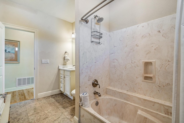 full bath featuring visible vents, toilet, tub / shower combination, baseboards, and vanity