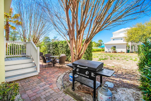 view of patio featuring grilling area and outdoor dining area