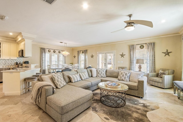 living room with marble finish floor, a healthy amount of sunlight, ceiling fan, and ornamental molding