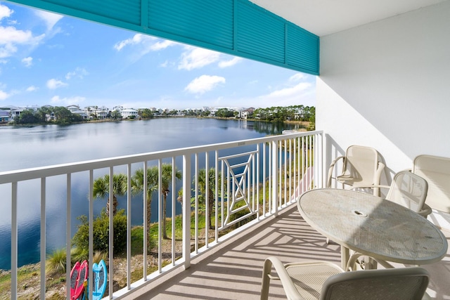 balcony featuring a water view