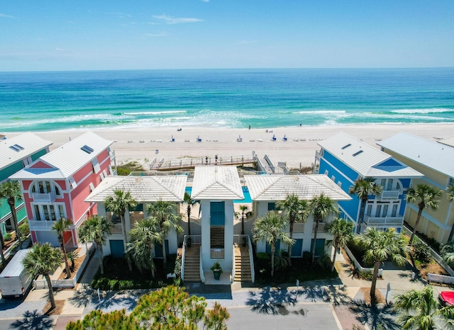 birds eye view of property featuring a view of the beach and a water view