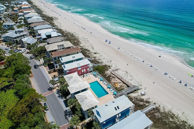 drone / aerial view with a water view and a view of the beach