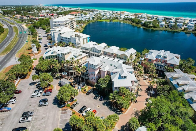 drone / aerial view featuring a water view and a residential view