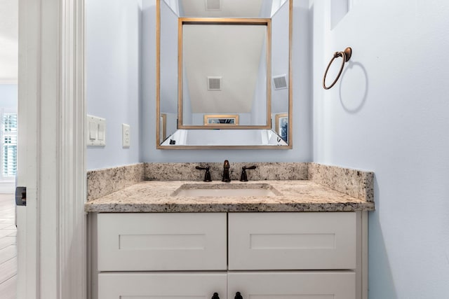 bathroom featuring vanity and visible vents