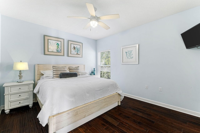 bedroom with hardwood / wood-style floors, a ceiling fan, and baseboards