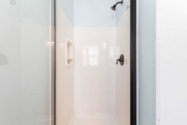 bathroom with a stall shower