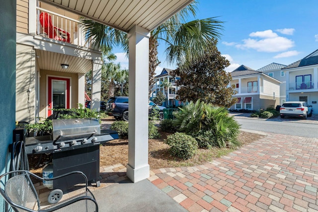 view of patio / terrace featuring a residential view and grilling area