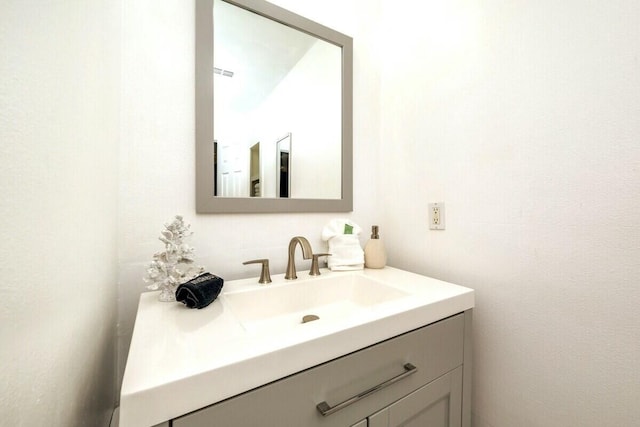 bathroom with visible vents and vanity