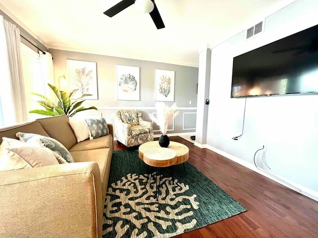 living area featuring ceiling fan, wood finished floors, visible vents, and baseboards