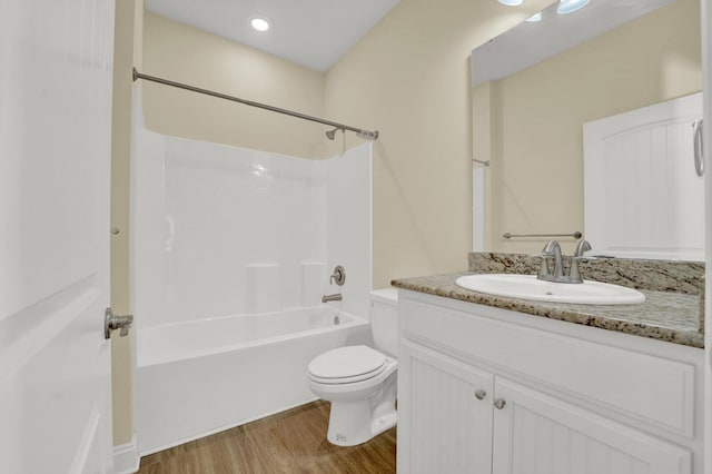 full bathroom featuring vanity, shower / bathing tub combination, wood finished floors, and toilet