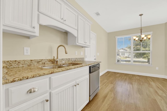 kitchen with visible vents, white cabinets, dishwasher, light wood-style flooring, and a sink