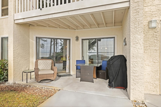 view of patio / terrace with a balcony and area for grilling