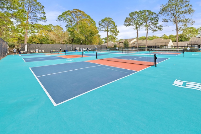 view of sport court with fence