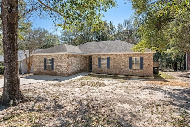 132 Lonnie Jack Dr, Crestview, FL 32536 - ranch-style house with cooling unit, brick siding, and roof with shingles