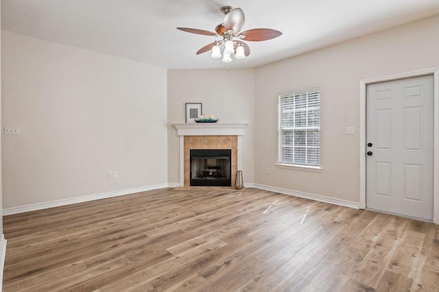 132 Lonnie Jack Dr, Crestview, FL 32536 - unfurnished living room featuring ceiling fan, a fireplace, baseboards, and wood finished floors