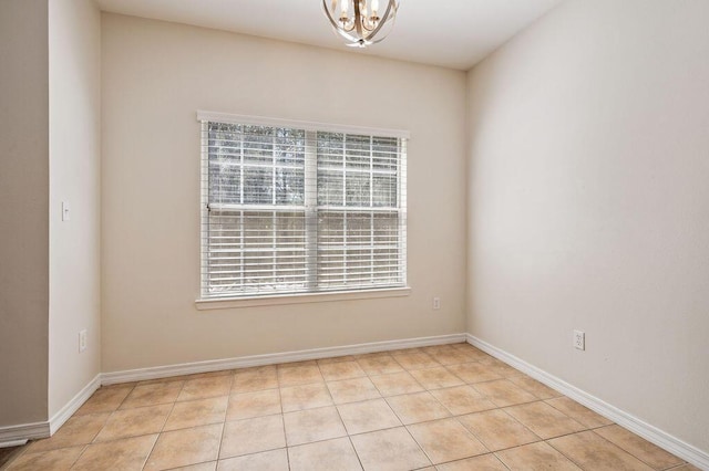 132 Lonnie Jack Dr, Crestview, FL 32536 - unfurnished room featuring light tile patterned floors, baseboards, and an inviting chandelier