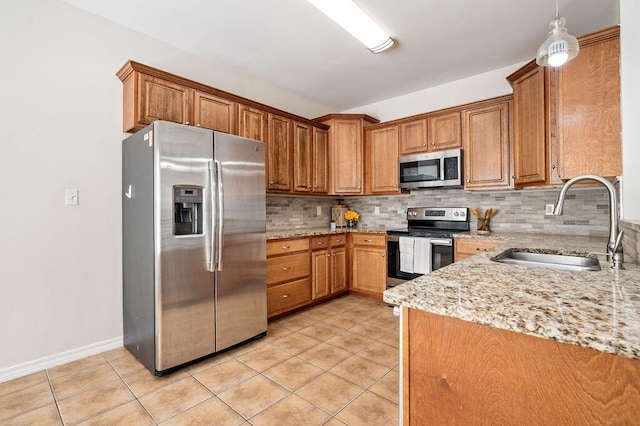 132 Lonnie Jack Dr, Crestview, FL 32536 - kitchen featuring a sink, stainless steel appliances, light tile patterned flooring, and decorative backsplash
