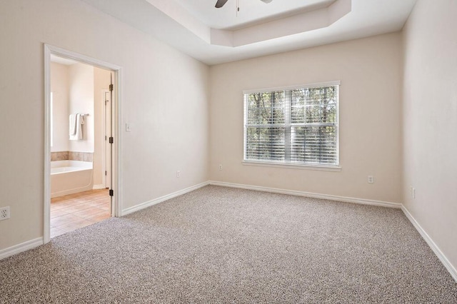 132 Lonnie Jack Dr, Crestview, FL 32536 - carpeted empty room with baseboards, a raised ceiling, and ceiling fan