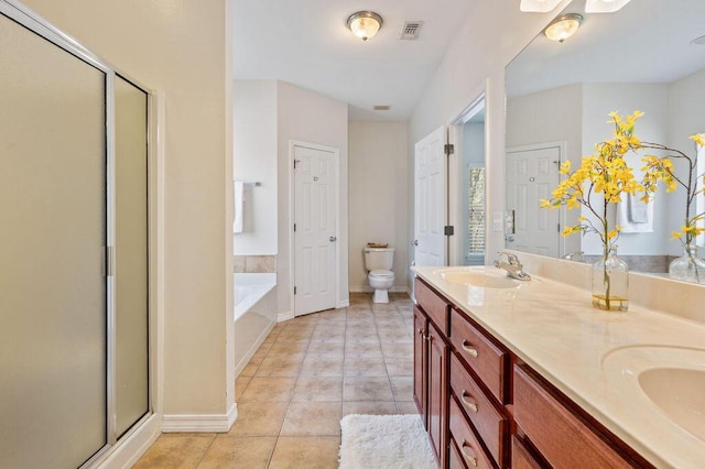 132 Lonnie Jack Dr, Crestview, FL 32536 - bathroom with tile patterned flooring, visible vents, toilet, a garden tub, and a sink