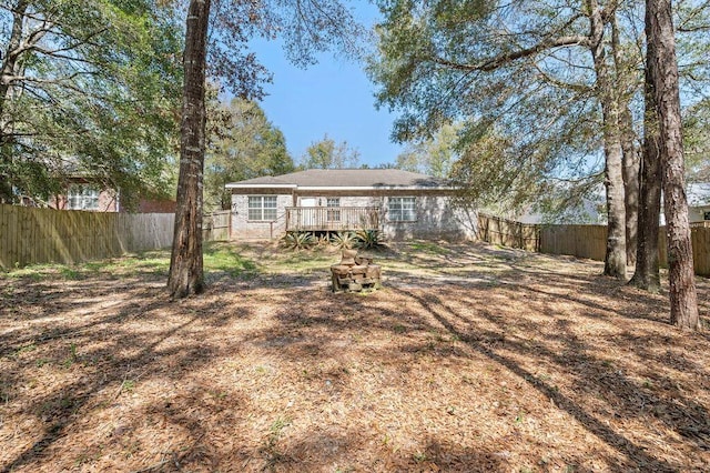 132 Lonnie Jack Dr, Crestview, FL 32536 - back of property featuring a deck and a fenced backyard