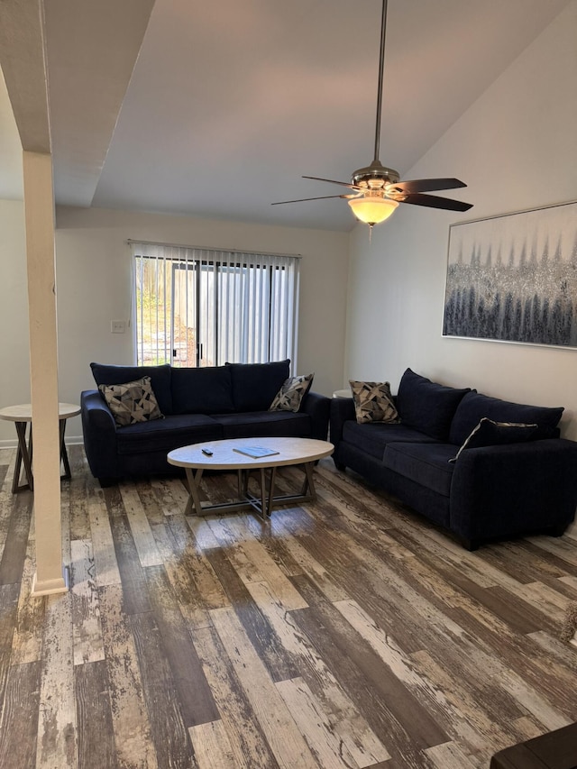 living room featuring ceiling fan, hardwood / wood-style flooring, and vaulted ceiling