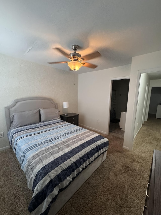 bedroom with ceiling fan, a textured ceiling, baseboards, and carpet floors