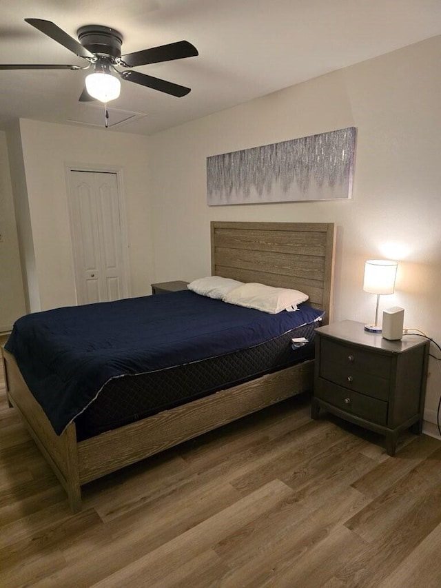 bedroom featuring a ceiling fan and wood finished floors