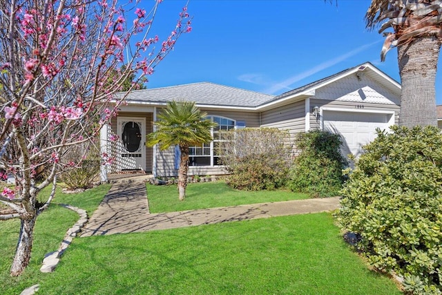 single story home with a front lawn and an attached garage