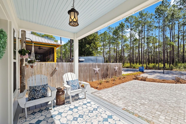 view of patio featuring fence