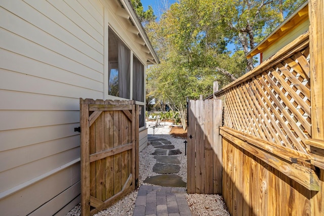 view of side of home with fence