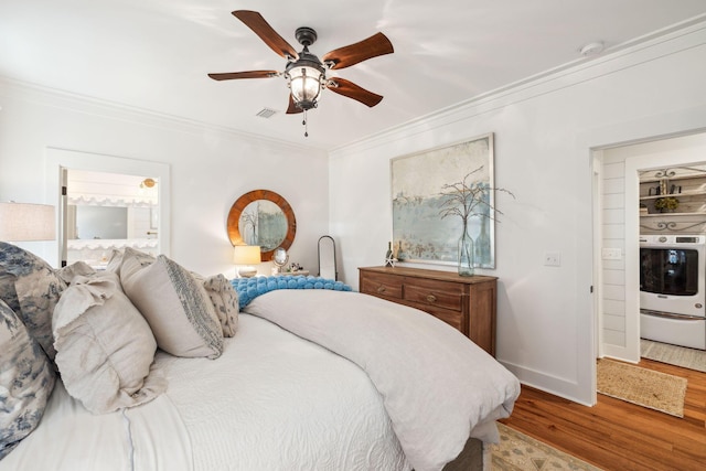 bedroom with visible vents, ceiling fan, baseboards, ornamental molding, and wood finished floors