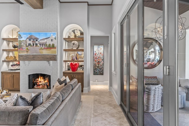 interior space featuring a brick fireplace, baseboards, and light tile patterned floors