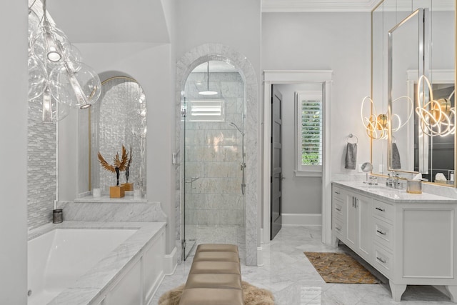 bathroom with marble finish floor, crown molding, a stall shower, vanity, and baseboards