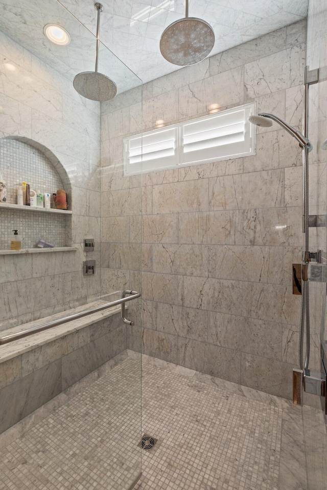 bathroom with tiled shower