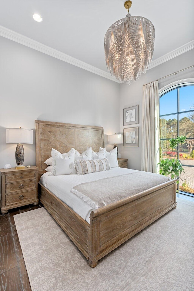 bedroom with a chandelier, recessed lighting, wood finished floors, access to exterior, and crown molding