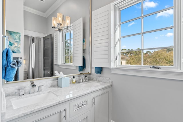 full bathroom featuring ornamental molding, a chandelier, a sink, and double vanity