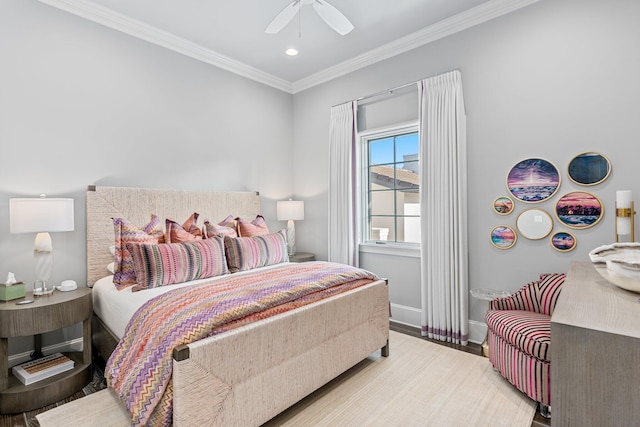 bedroom with ornamental molding, ceiling fan, baseboards, and wood finished floors